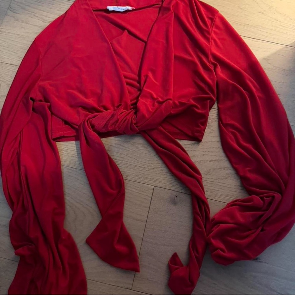 Red long sleeve top with tie detail size M